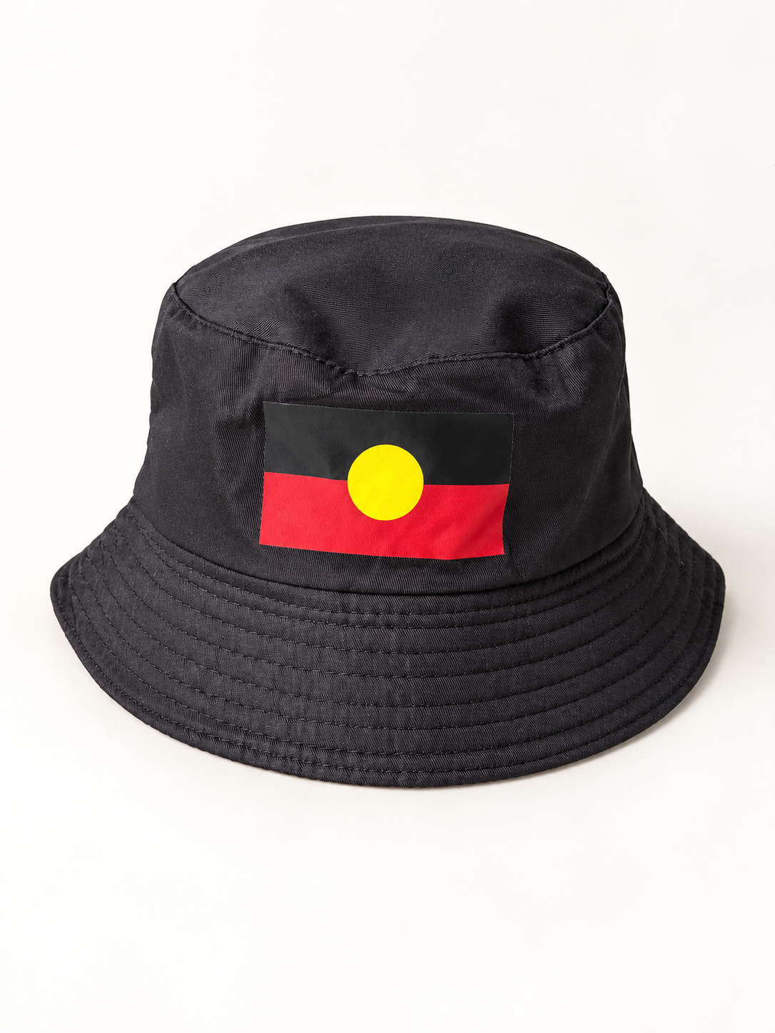 Black bucket hat with Aboriginal flag patch