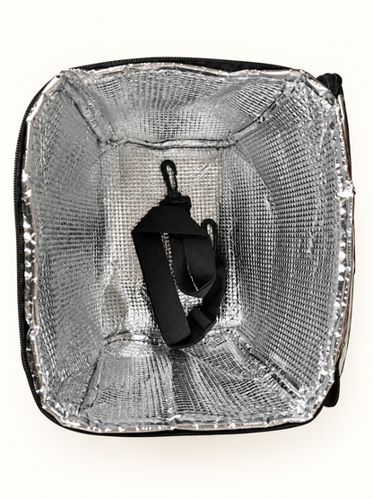 Silver insulated interior and shoulder strap inside cooler bag
