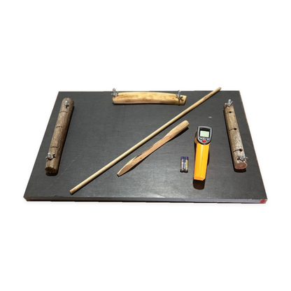 Friction board and thermometer set with two batteries on a white background
