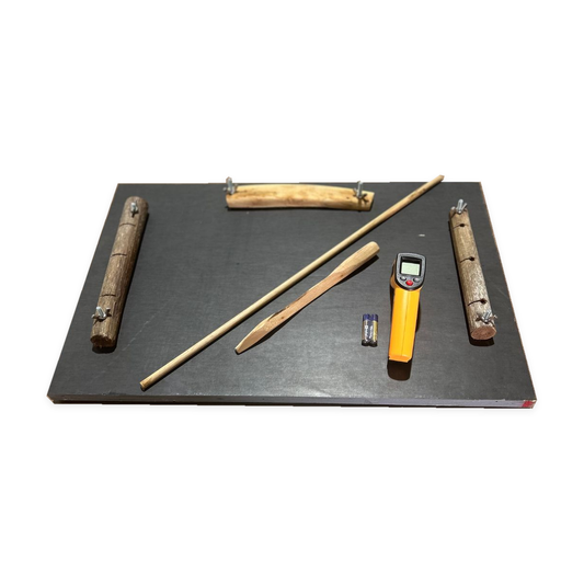 Friction board and thermometer set with two batteries on a white background