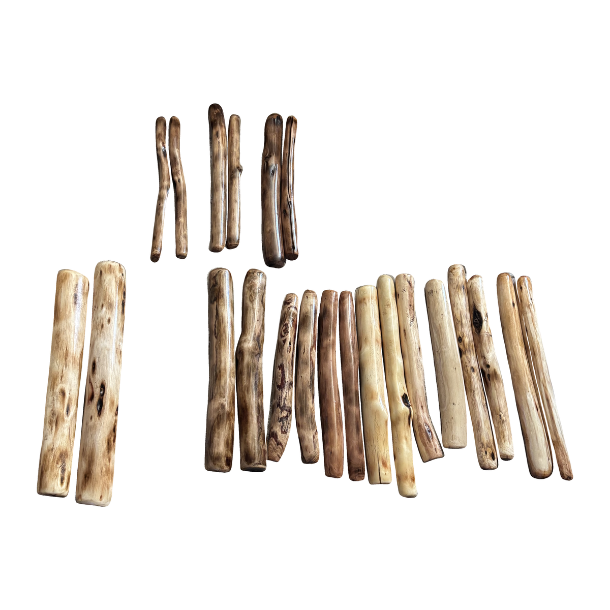 Group of Tasmanian stringybark clapsticks showing natural variation; each purchase is one pair of two sticks